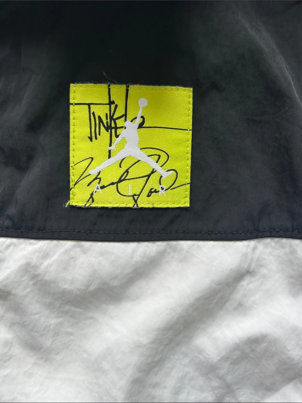 Jordan Tinker Legacy White and Black Performance Jacket with Yellow Logo Patch